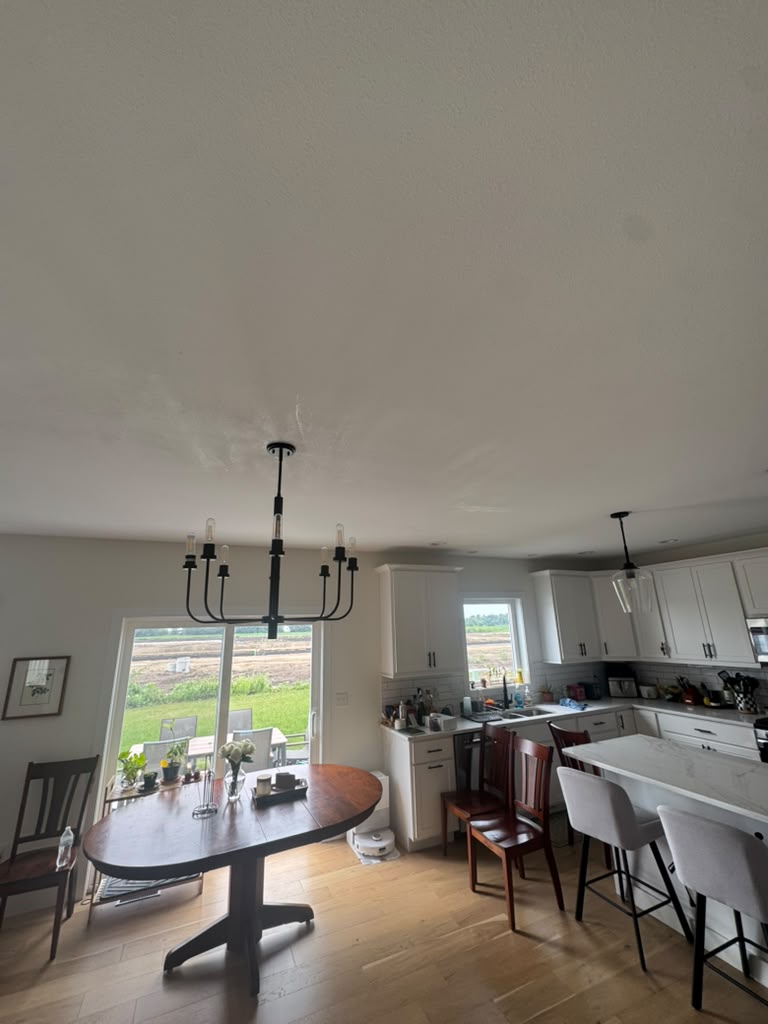 Kitchen ceiling with water damage before drywall repair