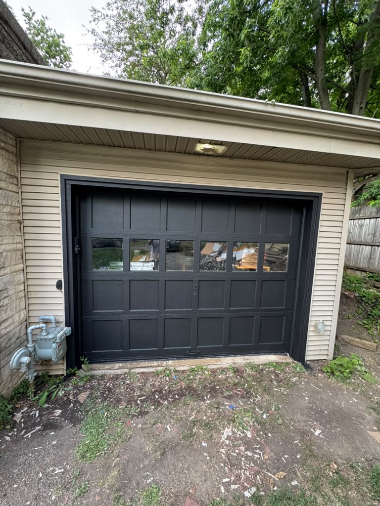 Garage door after professional repaint by Mechan LLC